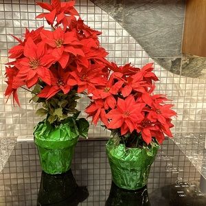 Two faux potted poinsettias. Two different heights.
